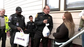 "Let us do something for you:" Sheriff's deputies hand out Thanksgiving meals