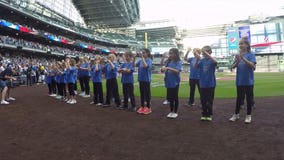 Elementary school students sign national anthem ahead of Brewers game