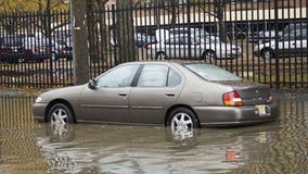 Jersey floods leave rail cars floating, homes in road post Sandy