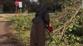 Chainsaw-wielding nun clears debris from Irma