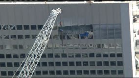 10 injured after piece of mechanical equipment being lifted by crane broke free in Manhattan