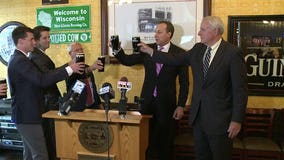 Mayor Barrett, other city officials "toast" the sale of downtown "Posner Building"