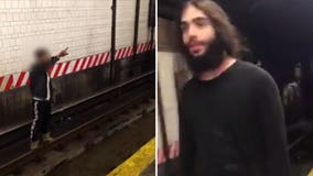 Police: Man throws victim onto Brooklyn subway tracks, hits him with metal lock