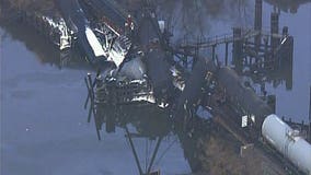 Train cars with toxic cargo fall off New Jersey bridge