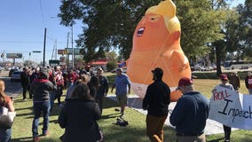 Towering 'Baby Trump' protest balloon slashed, deflated at Alabama appearance