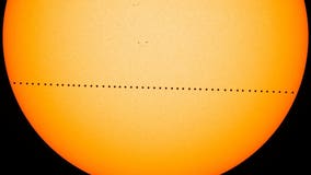 Mini Mercury skips across sun's vast glare in rare transit