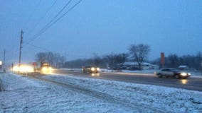 Light snow moving out of southeast Wisconsin; expect a windy afternoon