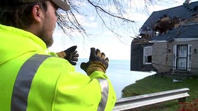 Crews begin 'extremely delicate' demolition of abandoned Somers home dangling over Lake Michigan