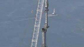 Crews install spire atop One World Trade Center in New York City
