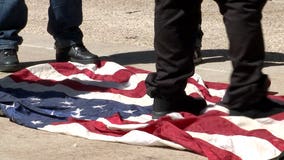 "Makes me sick:" Protester seen stomping on American flag outside Trump town hall at UWM