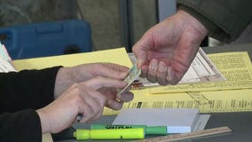 Federal judge blasts Wisconsin officials over voter ID confusion, yet keeps law in place