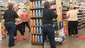 Woman without mask commands 'demon' customers to leave grocery store aisle until she's done shopping