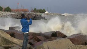 "The waves are monstrous:" Crowds of curious onlookers along Lake Michigan