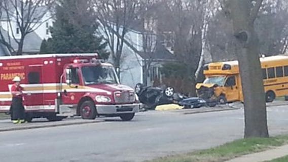 Fatal wreck: Car overturns after slamming into school bus