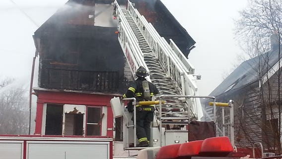 "A big old fire and flames. Unbelievable!" Firefighters battle blaze at vacant home on north side