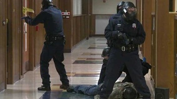Police recruits take part in "active shooter training"