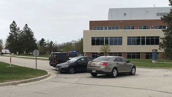 Man arrested after witness reported him loading handgun outside Waukesha County facility