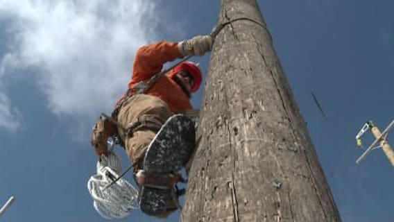 We Energies crews work to restore power during extreme wind