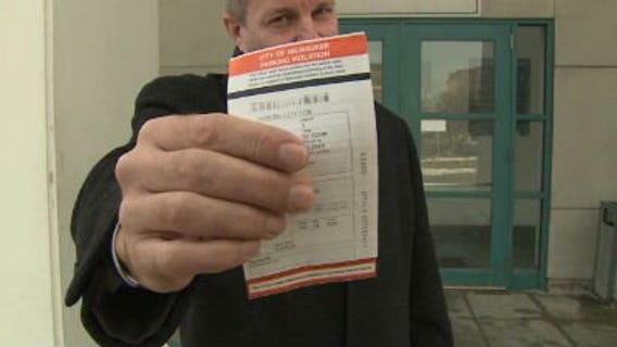Brad Hicks fights parking ticket after meter blocked by snow