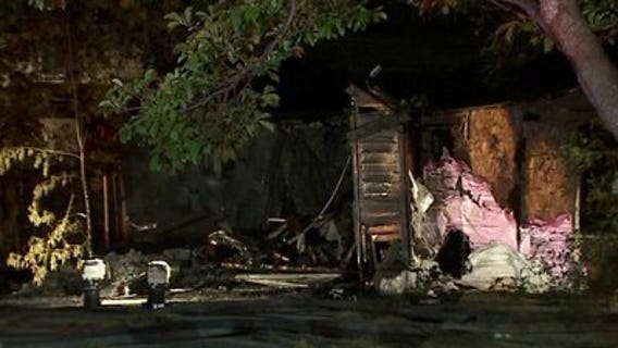 Fire officials battle fully-engulfed fire at vacant home