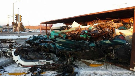 Police: Trailer carrying crushed cars tips over, cars spill onto roadway in Waukesha