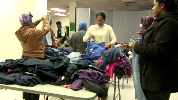 "Why sell them? We could donate them!" Family hands out clothing to kids at school in Milwaukee