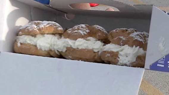 Cream puff giveaway winners line up to get their sweet treat at State Fair Park