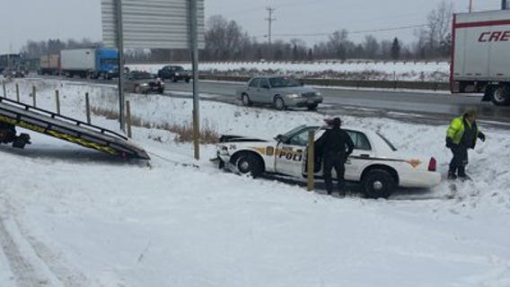 Racine officer hurt after squad is struck, ends up in ditch
