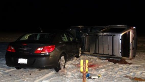 Two people hurt after SUV rolls over, car strikes SUV