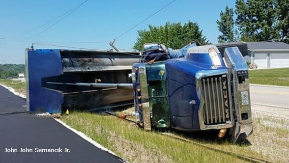 Dump truck takes down power lines in rollover crash near Elmwood School in New Berlin