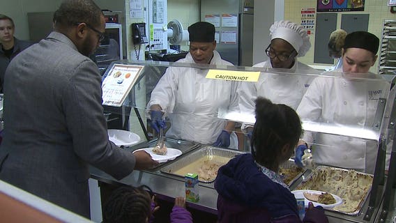 Serving others feeds us all: MPD officers, MATC, Messmer students, volunteers serve Thanksgiving dinner