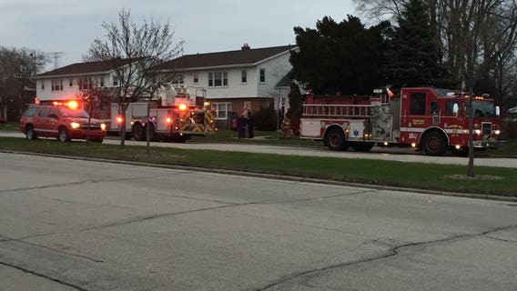 Red Cross assisting two adults, child after fire near 61st and Florist