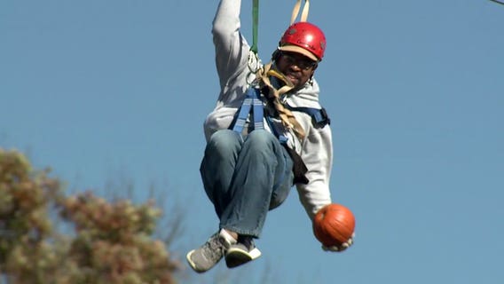 "Close your eyes and aim!" Pumpkin drop in Lake Geneva involves zip-line and bullseye