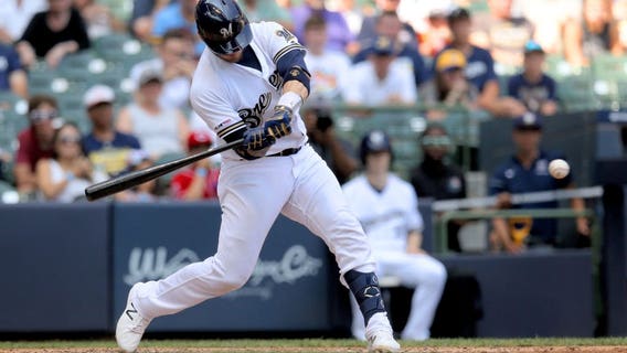 Grandal, Hader lift Brewers over Reds 5-4 to avoid sweep