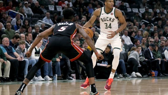 Heat spoil Bucks' home opener, rally to 131-126 win in OT
