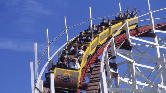 Care-free days at theme parks giving way to virus safeguards