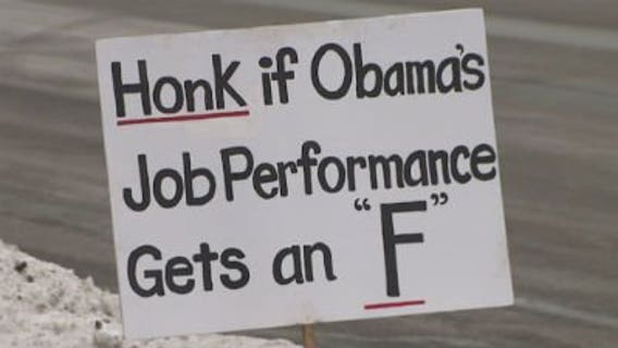 Supporters, protesters greet Pres. Obama outside GE plant