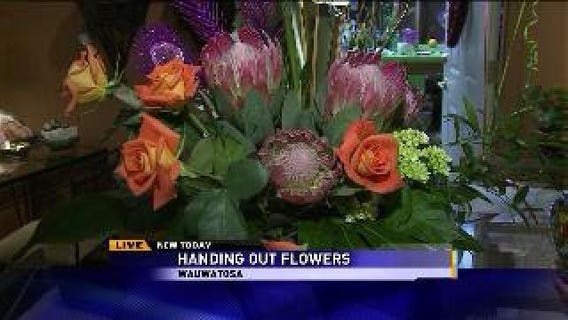 Handing out flowers with Laura Langemo