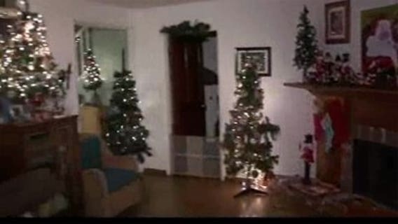 California woman decorates home with 103 Christmas trees!