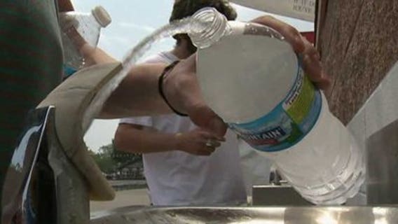 Fourth of July revelers brave record-setting temperatures