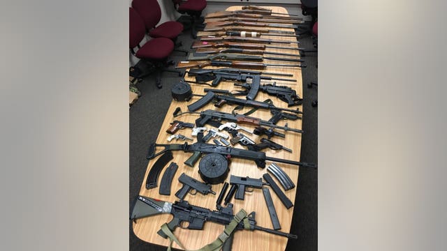 Two men arrested as about 35 firearms, thousands of rounds of ammunition seized from home