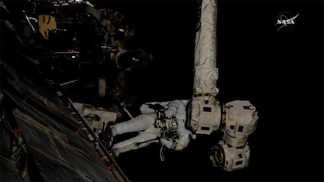 Spacewalkers install new hand on station's robot arm