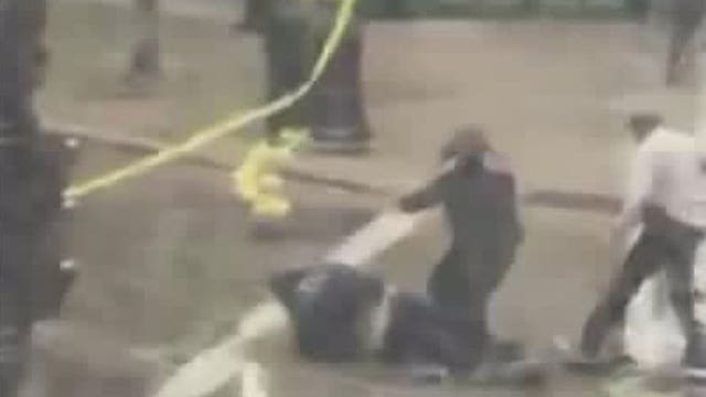 Police tackle man who went under tape at suspicious package incident in downtown Milwaukee