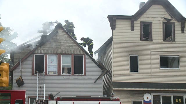 17 displaced after blaze spread to 2nd home on south side; 2 firefighters hurt