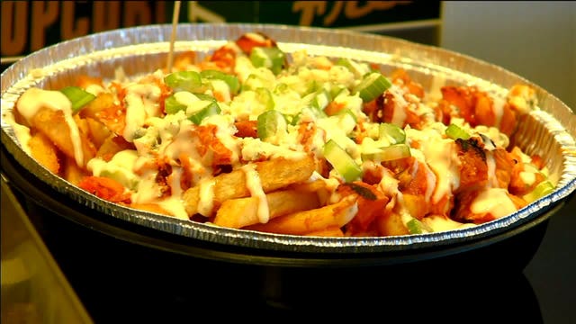 "Hail Mary" brat, Poutine, "Pig Skin" baked potato among the new food items at Lambeau this season