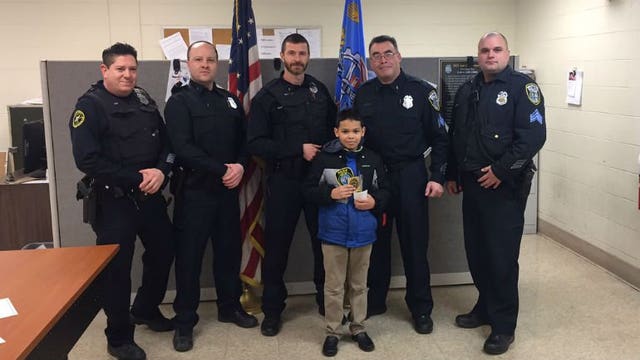 9-year-old boy buys pizzas for Milwaukee police officers using his own money