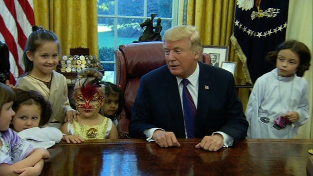 President Trump greets kids in Oval Office for early Halloween treats