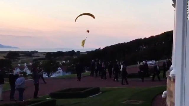 Paraglider charged in President Trump resort flight; Finns demonstrate