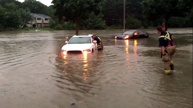 Wisconsin National Guard troops help sandbag areas of Madison affected by heavy rain