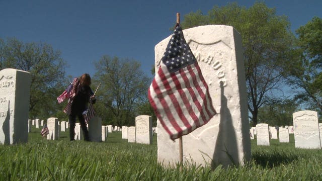 Thousands of flags decorate Wood National Cemetery
